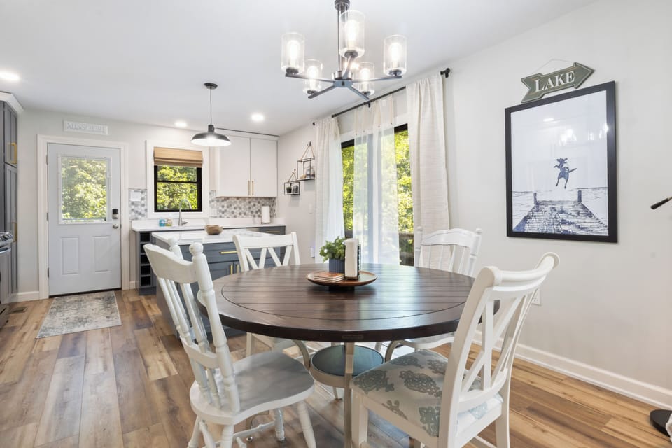 3 chairs from outside bistro table will also fit comfortably around dining table