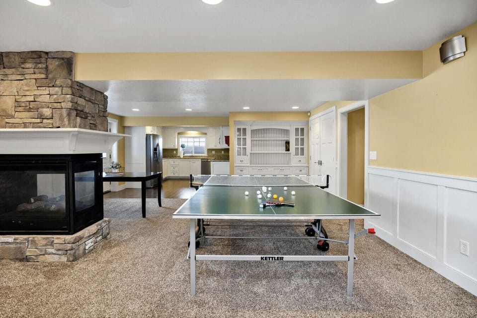 Have some fun in the lower-level living space, complete with a ping pong table