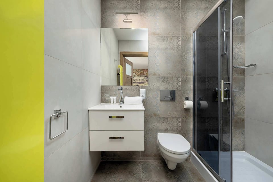 The bathroom offers a clean and functional space for your stay.