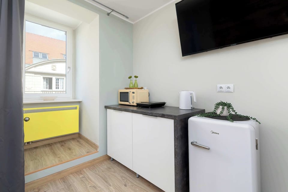 The fully equipped kitchenette includes everything you need for a home-cooked meal.