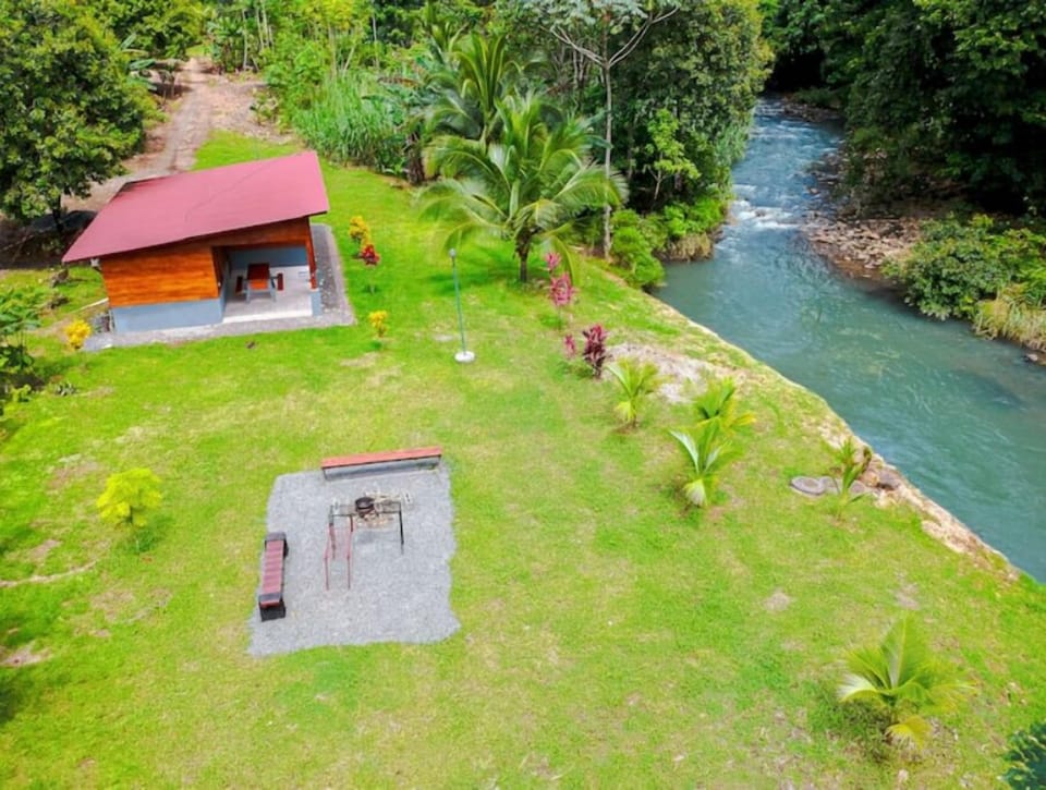 Peaceful river right in front of the cabin — perfect for swimming and relaxing.