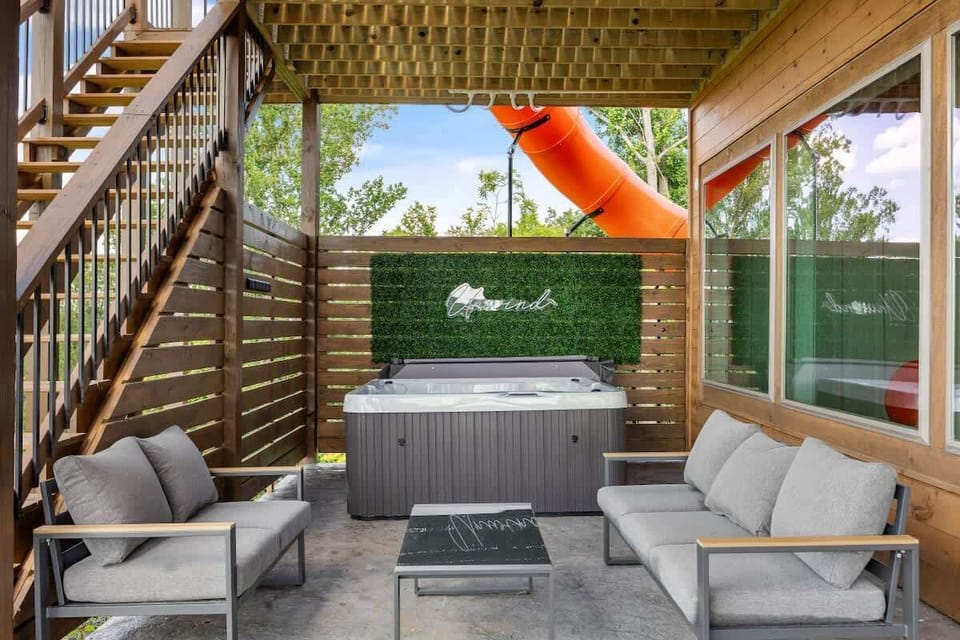 Lowest level hot tub and outdoor lounge area 