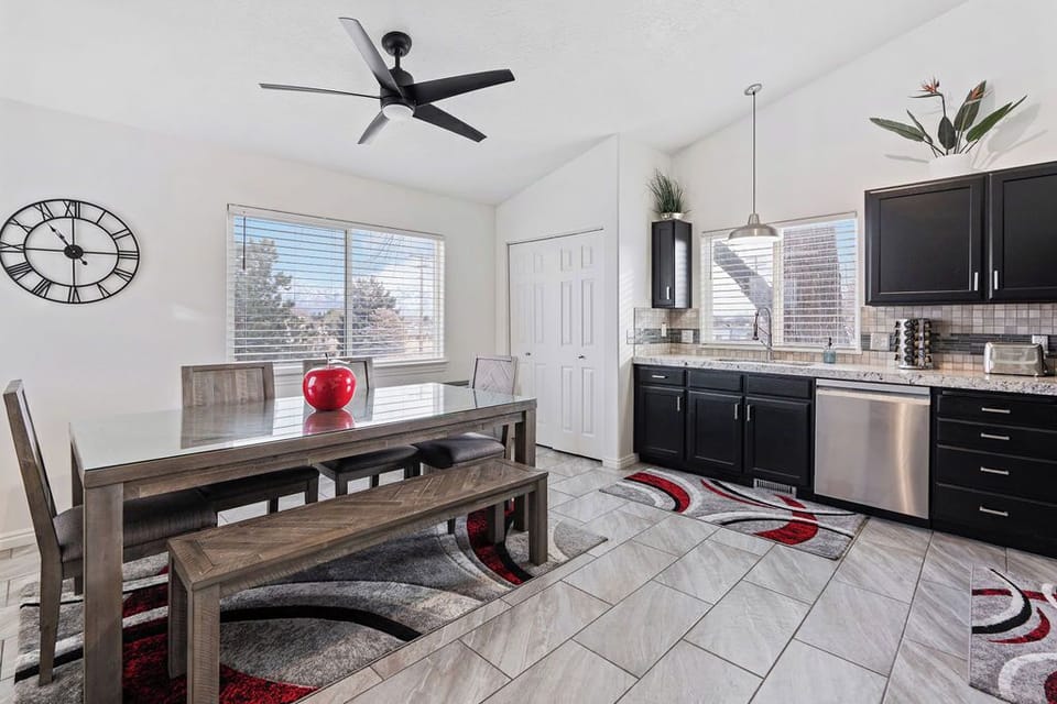 Dining area with a spacious table perfect for group meals or family board games.