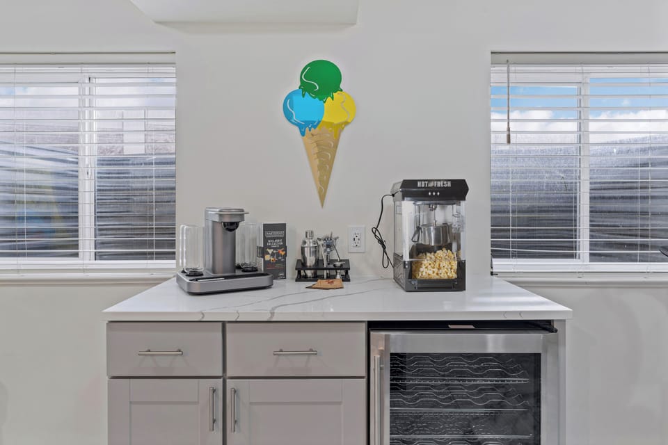 Cocktail mixer, Popcorn machine and mini fridge. 