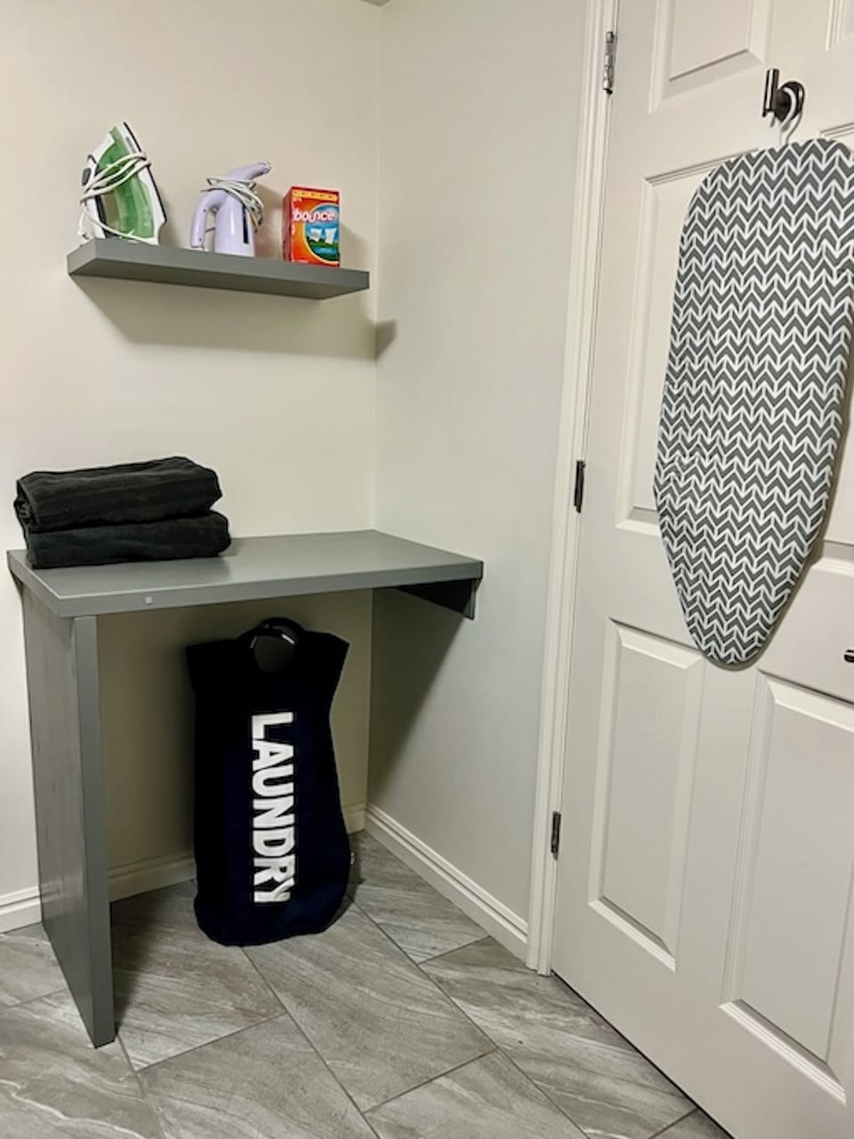 Folding table, iron board, iron, and steamer for all your laundry needs.