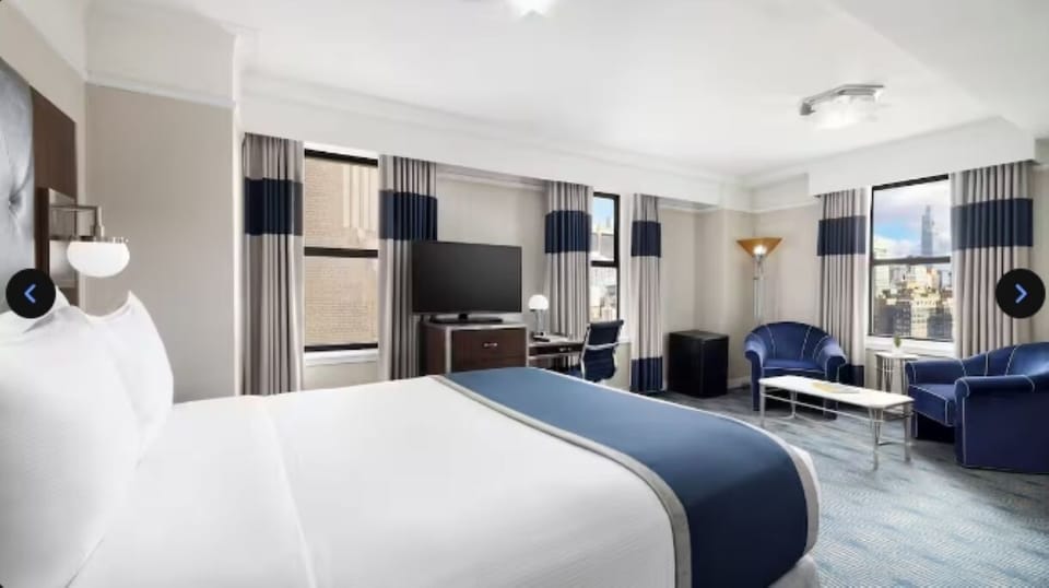 Unwind in a chic king room with city views.