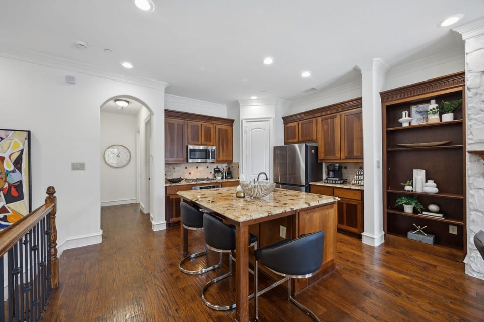 View of 2nd floor kitchen with stainless steel appliances & Keurig coffee pot. 