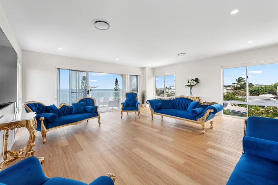 Regal comfort meets panoramic coastal views — this stunning third-level living space invites you to relax in elevated elegance.