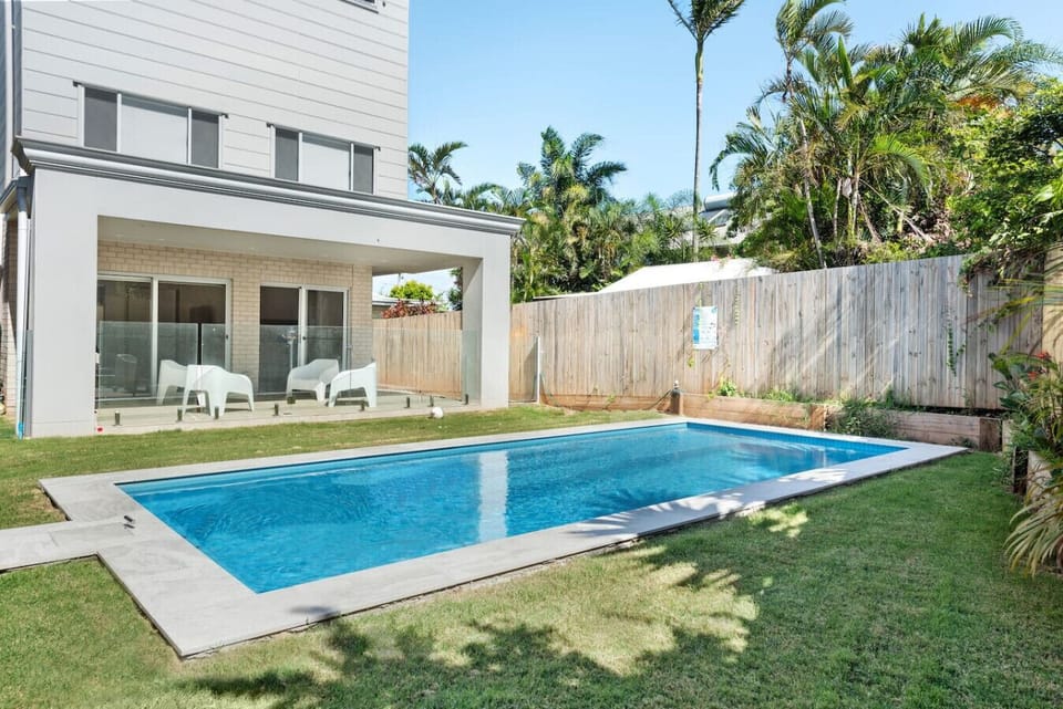 Tucked behind the home, this sparkling pool offers the perfect balance of privacy and paradise.