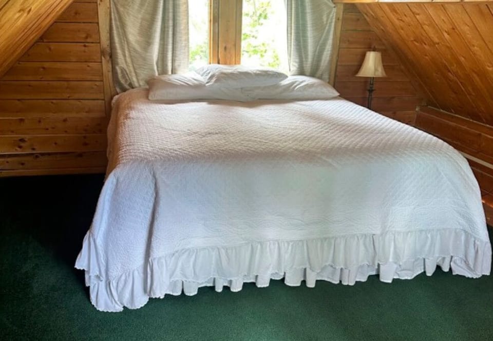 King bed located up on the loft. 
