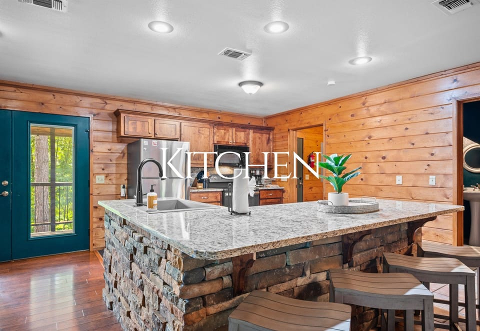 Granite countertops, island seating, and everything you need to cook like home.