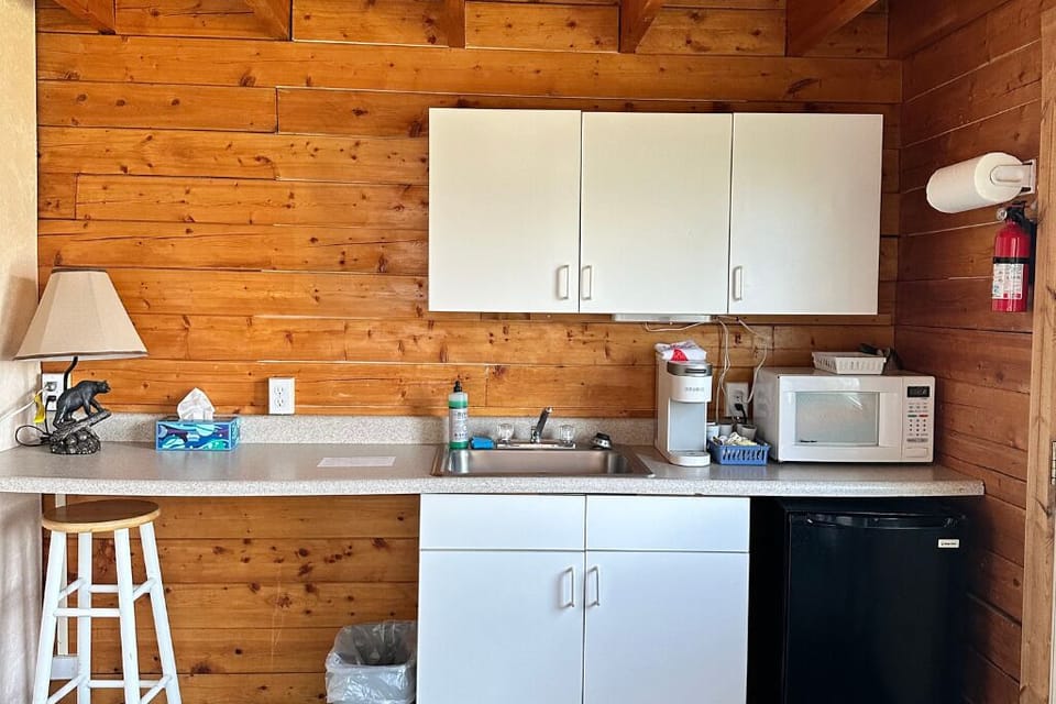 Kitchenette area with seating. 
