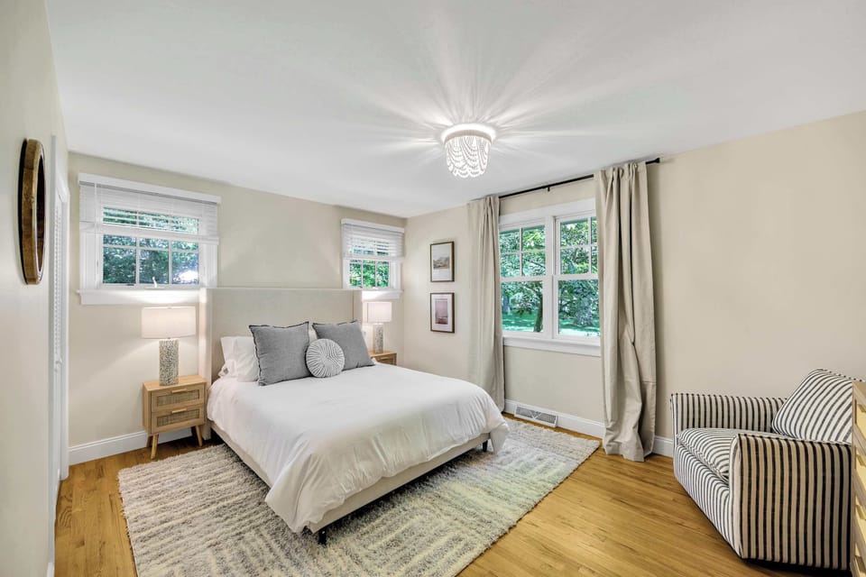 Light-filled retreat with two large windows and calming neutral tones.