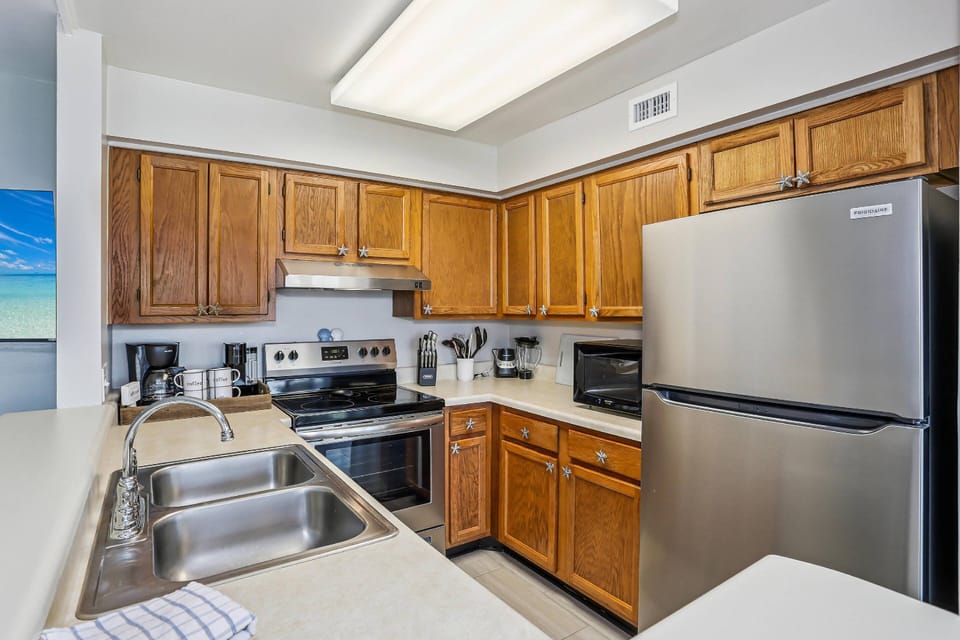 Fully stocked kitchen with stainless appliances