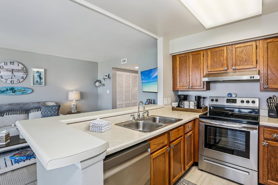 The kitchen overlooks the living and dining areas