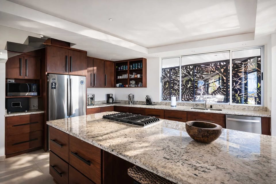 Fully Equipped Gourmet Kitchen with Custom Wood Island, Modern Appliances & Open-Concept Design for Entertaining