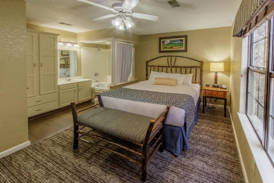 Unwind in a cozy king bed with warm, homey charm.