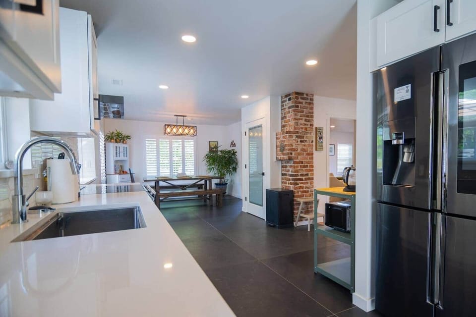 Expansive kitchen awaits your gourmet creations with the latest appliances and equipment