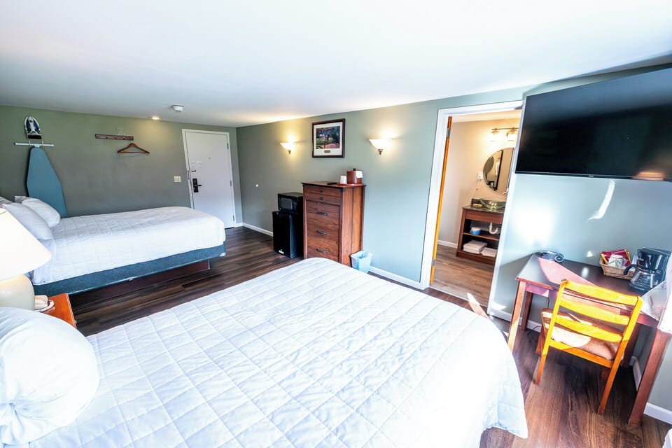 Spread out comfortably with a handy desk and in-room TV.