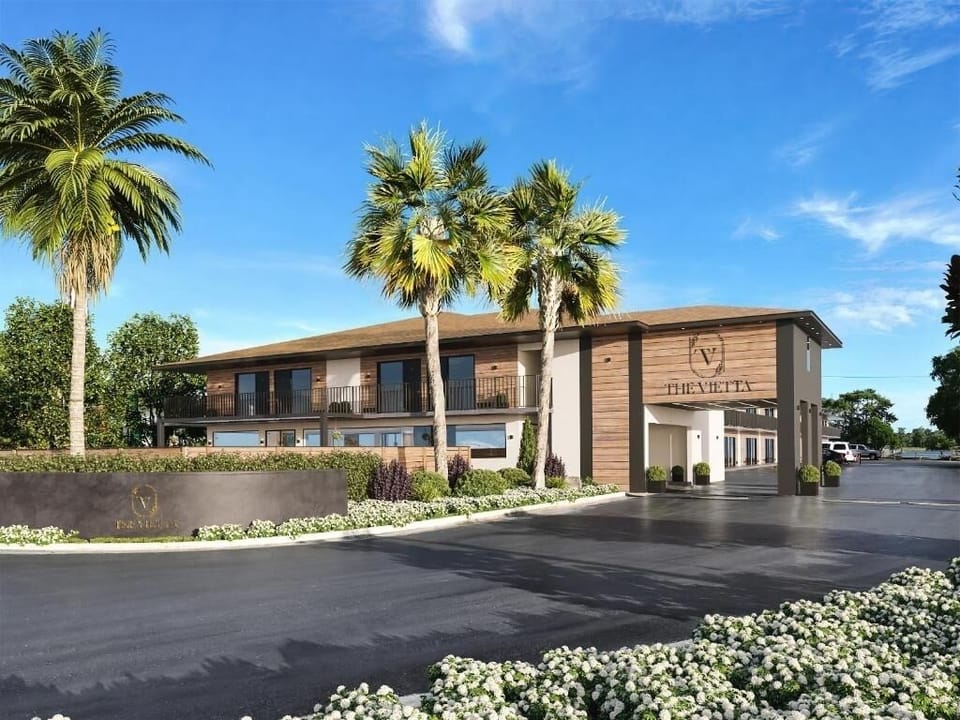 Arrive with ease at this polished, palm-lined property entrance.