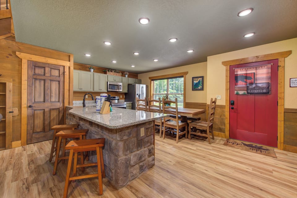 Kitchen with granite countertops and stone accents.