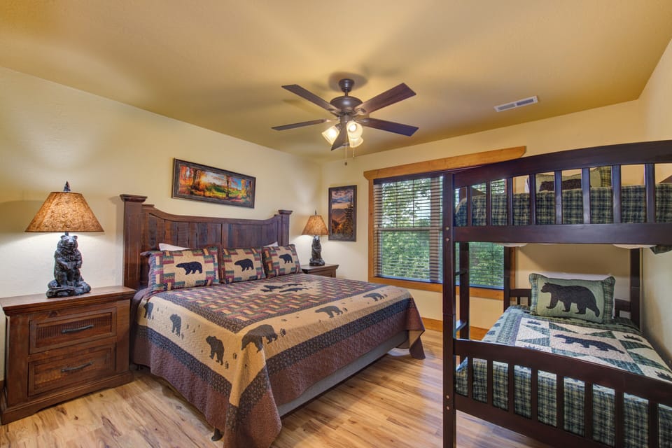 King bedroom with twin over twin bunks.