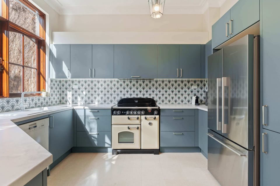 A well-equipped kitchen featuring a fridge, dishwasher and oven for all your cooking needs.