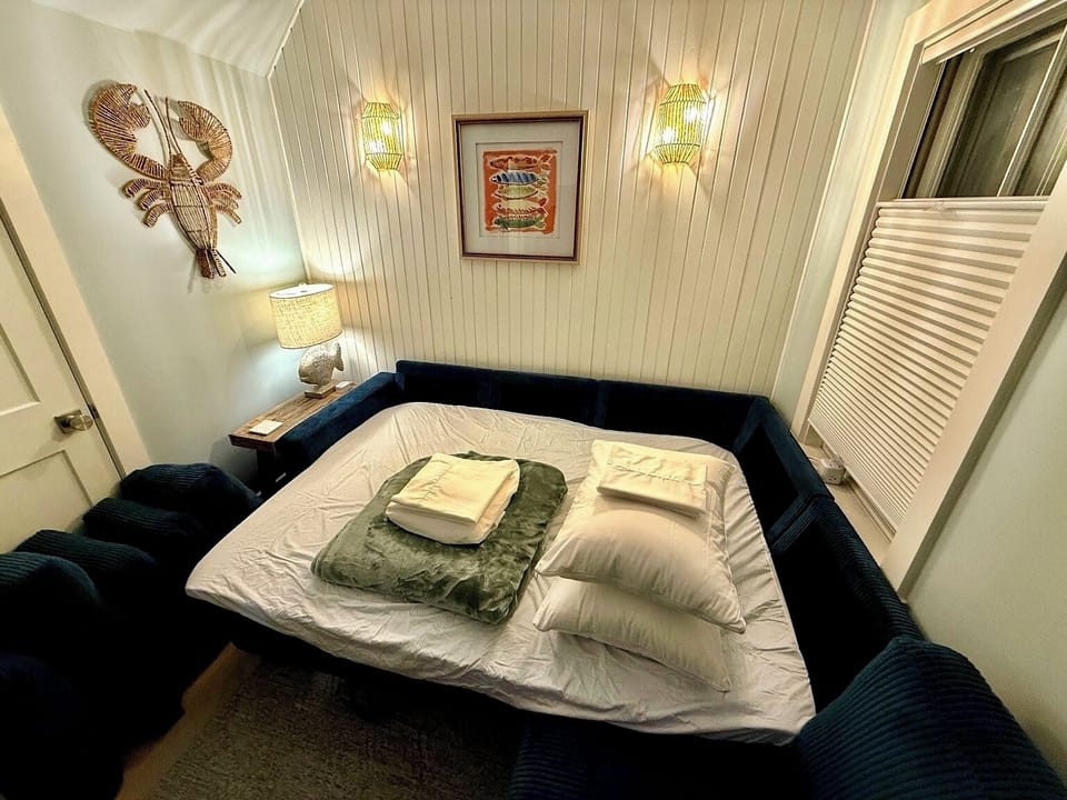 Living room couch opens to a full bed, we provide a pad and all you need!