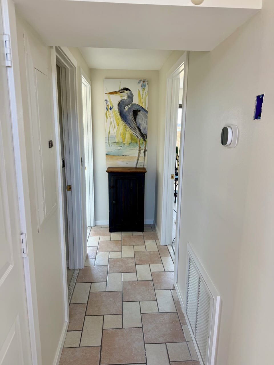 The hallway from the great room to the 2nd and 3rd bedrooms and a full bath.