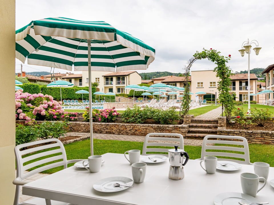 Plant, Furniture, Table, Tableware, Property, Sky, Chair, Green, Building, Outdoor Furniture