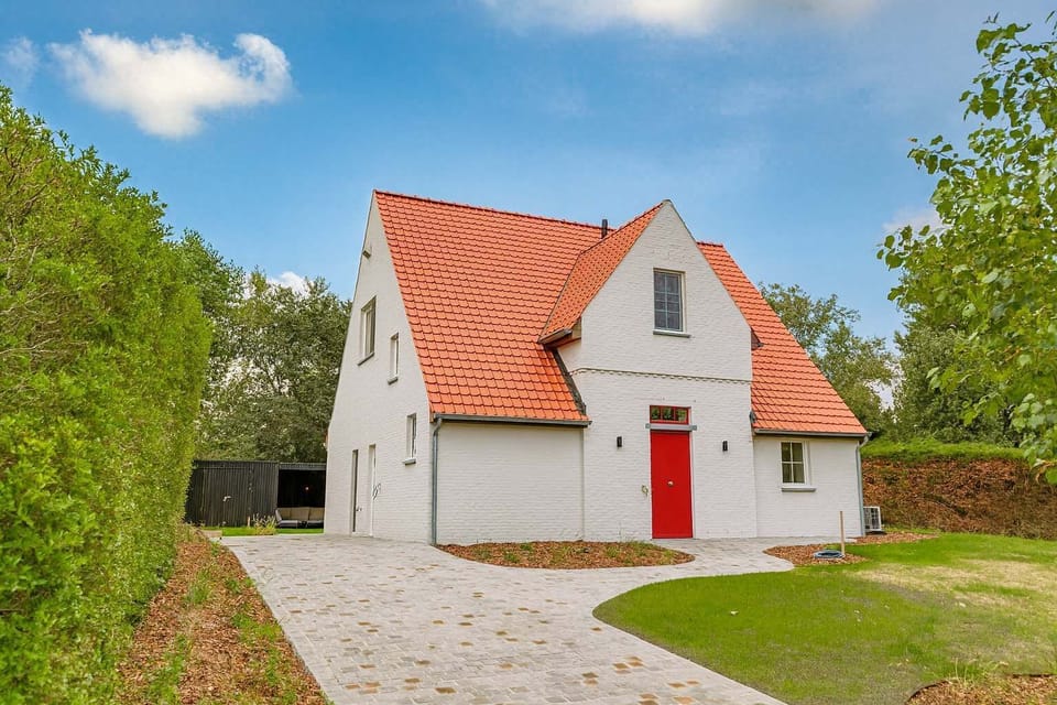 Welcome to Your Beach Holiday Home: Front View of the House with Private Driveway