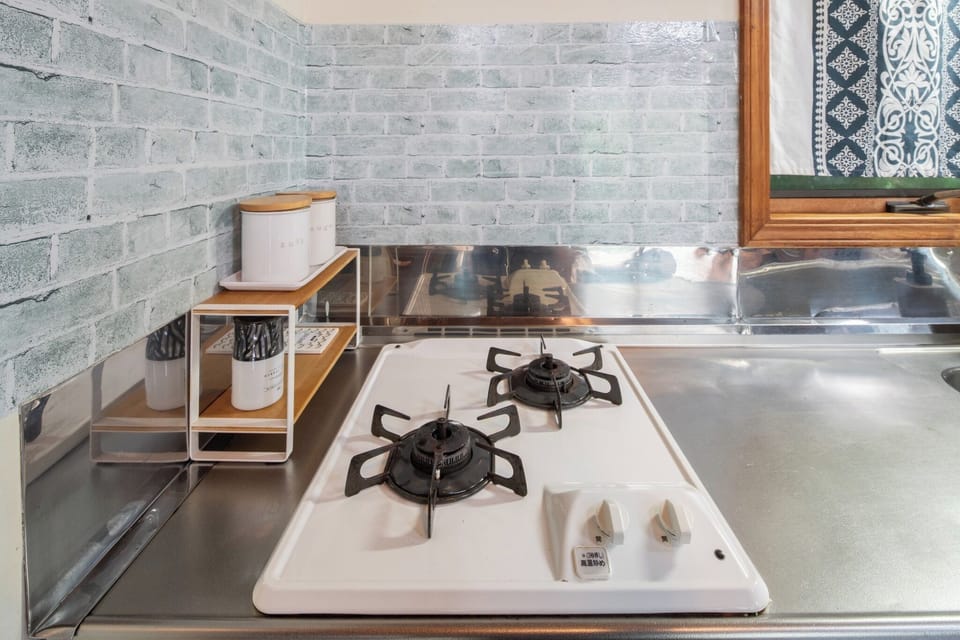 There is a two-burner gas stove in the kitchen.
