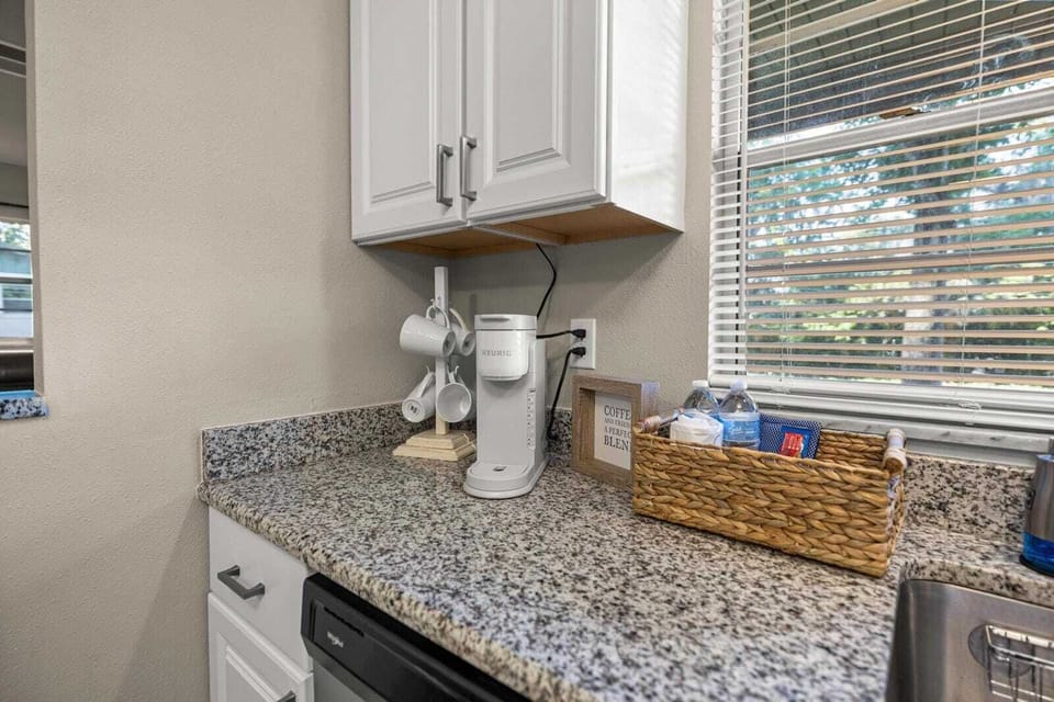 Start your day right—coffee station with mugs, bottled water, and a cheerful morning vibe