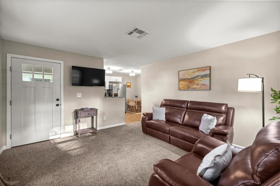 Spacious and connected—relax in the cozy living room or gather around the table just steps away