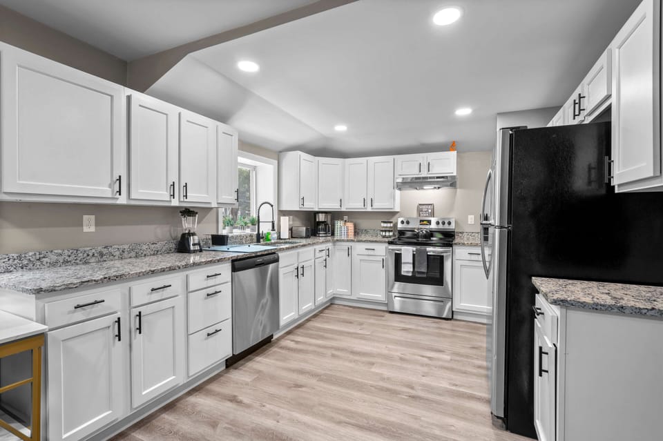 Renovated, fully stocked kitchens with stainless steel appliances, granite countertops and all the cooking essentials