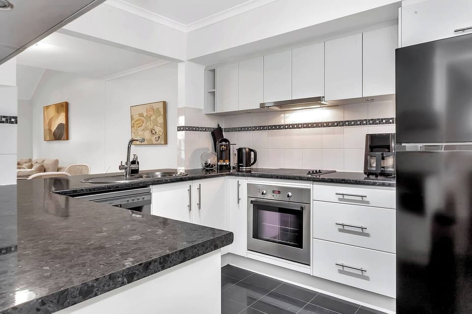 The fully equipped kitchen includes modern appliances, a Nespresso machine and generous counter space for preparing anything from morning brekkie to dinner.