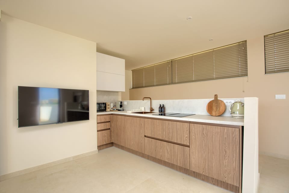 Fully equipped kitchenette with cooktop, Nespresso machine, microwave, + more