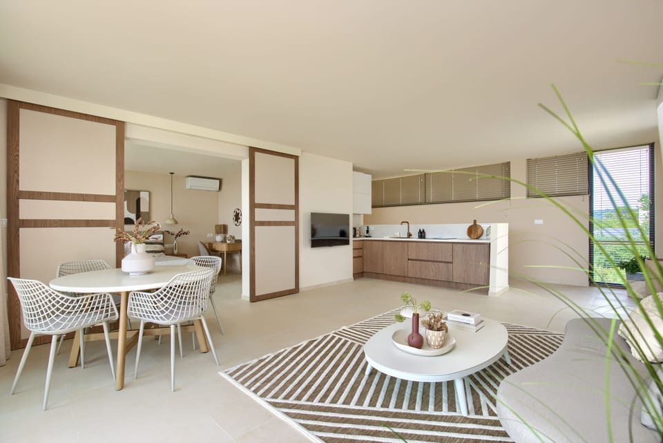 Dining for four, modern lighting & direct access to private balcony