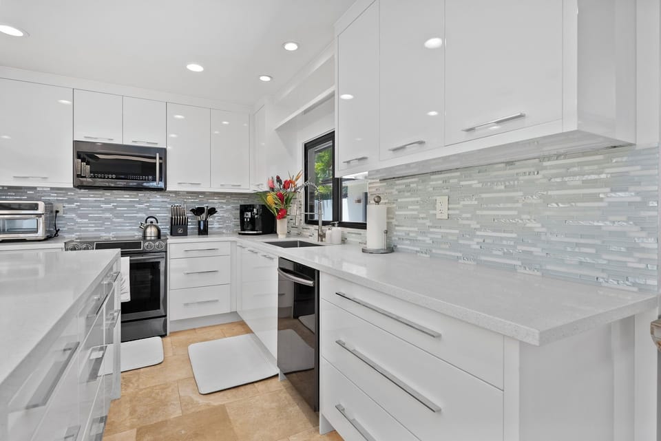 Everything at your fingertips—modern layout and streamlined convenience in the Honolulu Lagoonfront Estate kitchen.