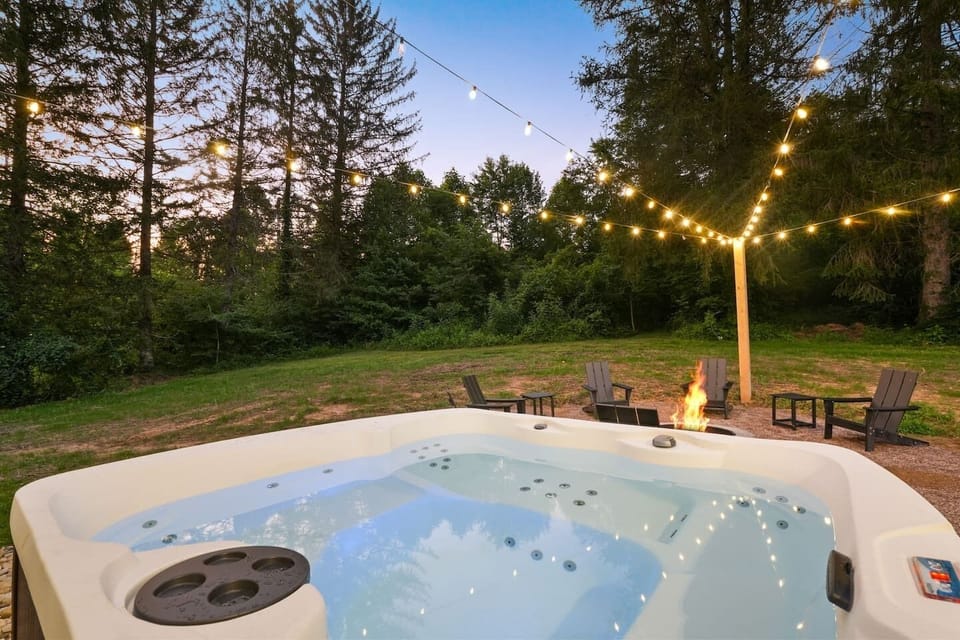 Spend evenings under the string lights gathered around the fire pit or soaking in the private hot tub, the perfect setting for laughter, relaxation, and making unforgettable memories.