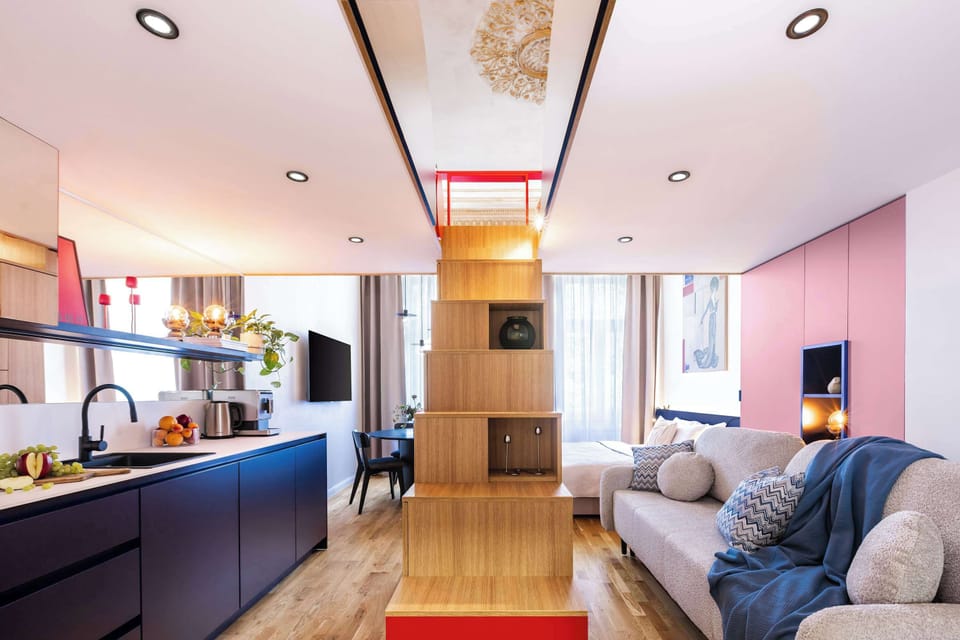 Lower floor of the apartment with kitchen, sitting area, bedroom and convertible sofa