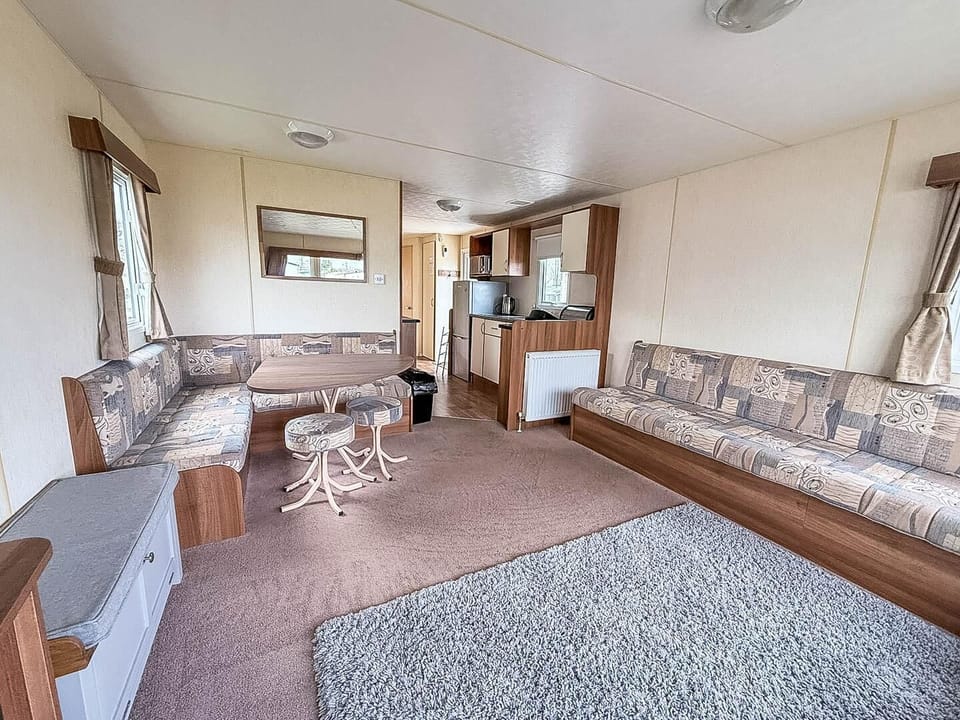 The base of this classic caravan is its wonderfully spacious open-plan lounge and dining area, designed for connection and comfort. Relax together after a day of adventure on the Norfolk coast.
