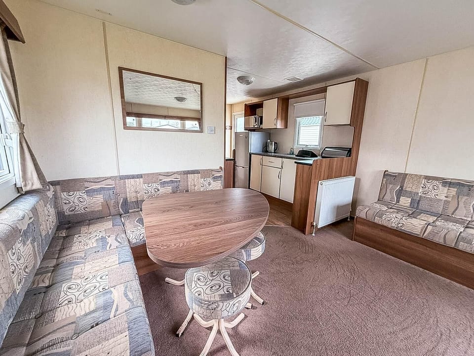 This open area seamlessly connects the kitchen, dining, and lounge areas, creating a wonderfully social and inviting atmosphere for everyone.