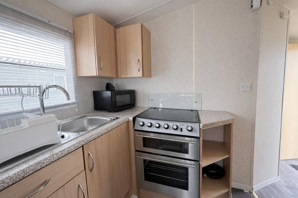 The kitchen and dining area in your 2cHolidays caravan is a space where memories are made.