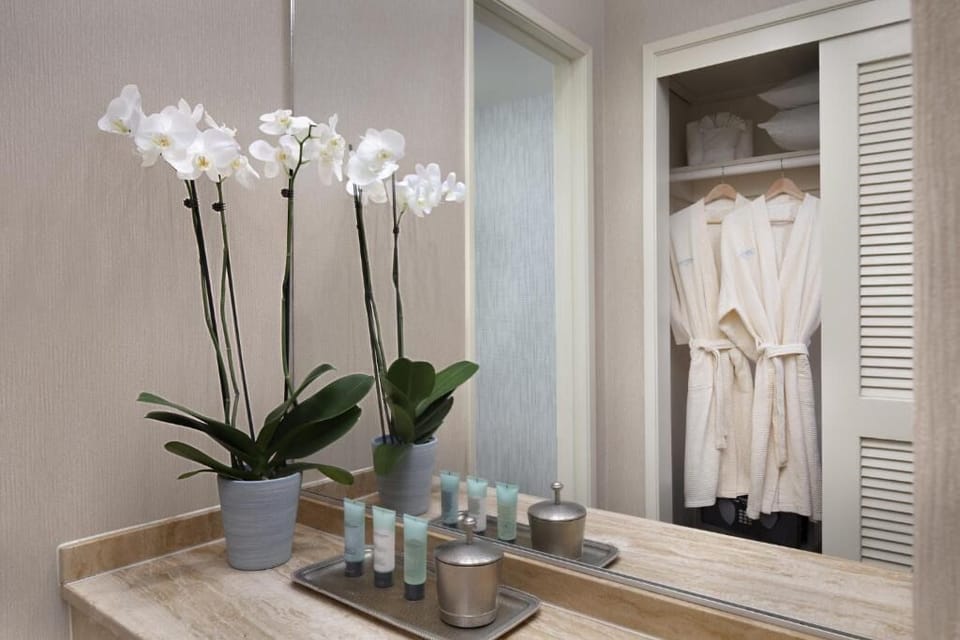 Freshen up with spa-style toiletries and plush robes nearby