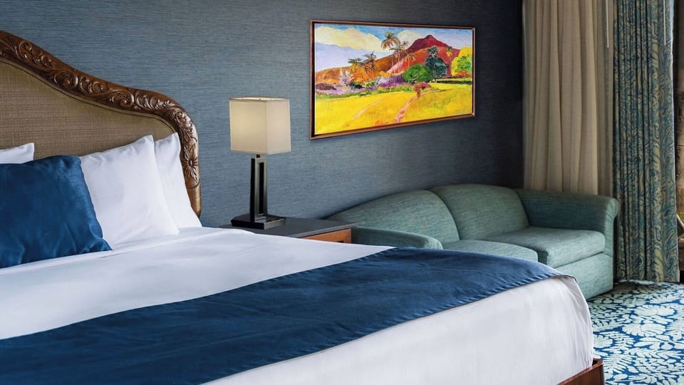 Sink into plush bedding and enjoy a cozy lounge corner.