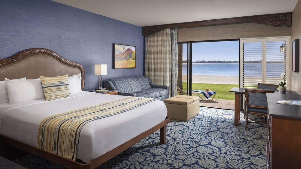 Unwind in crisp linens with a serene beachfront outlook.