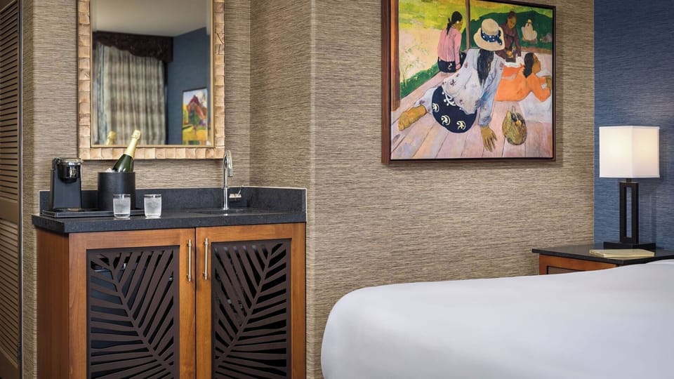 Sip morning coffee beside the in-room bar and sink.