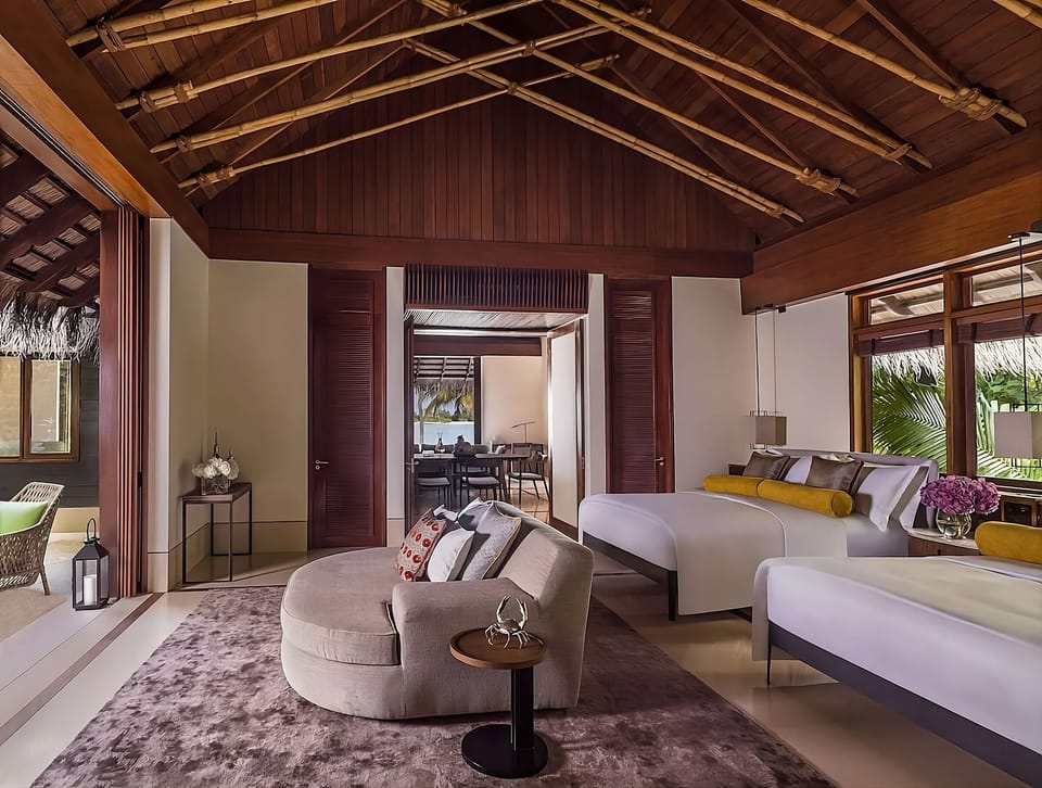 Unwind together in airy twin beds with plush lounge seating.