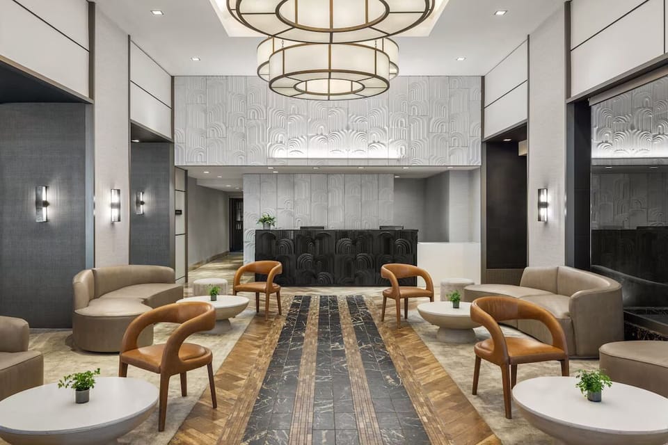 Arrive to a sleek lobby with stylish seating and glow.